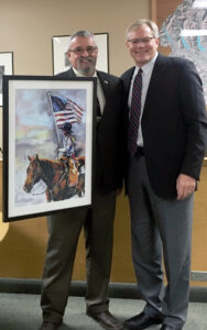 Commissioner Obie O'Brien and WSAC Executive Director Eric Johnson celebrating Commissioner O'Brian's service as WSAC President during 2017.